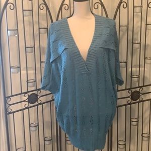 Sweater with deep v neck and deep side openings